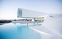 009-pool-with-a-house-subverts-suburban-tradition-in-granada.jpg