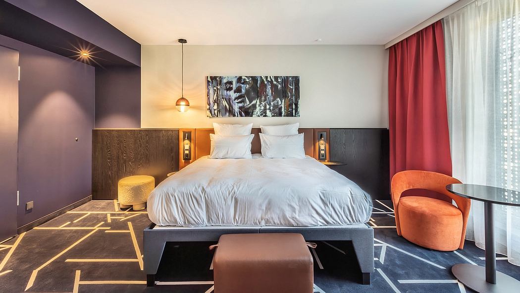 Luxurious bedroom with modern decor, wood accents, and vibrant red curtains.