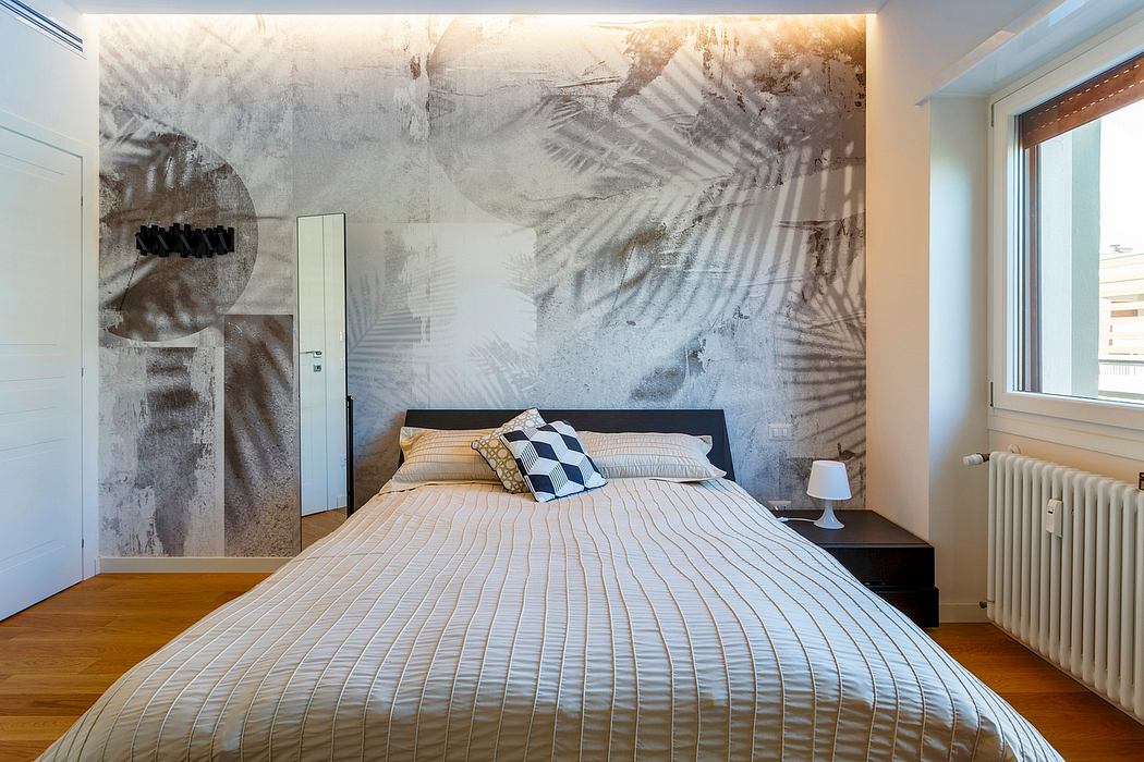 Modern bedroom with abstract palm leaf mural, sleek black bed frame, and wooden floors.