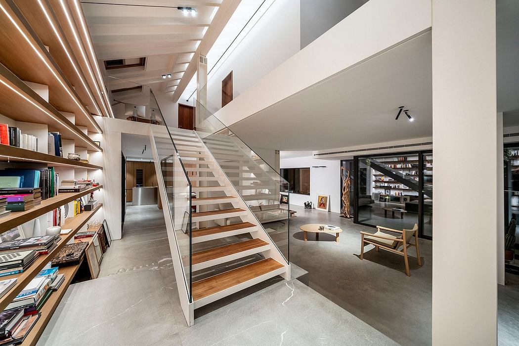 Sleek, minimalist interior with wooden stairs, glass barriers, and open shelving.