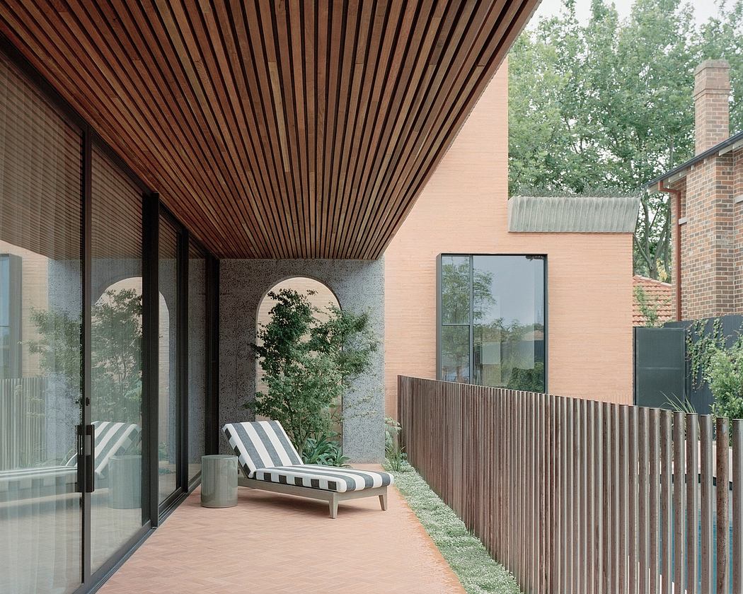 Striking wooden beams, floor-to-ceiling glass, and sleek outdoor lounging area.