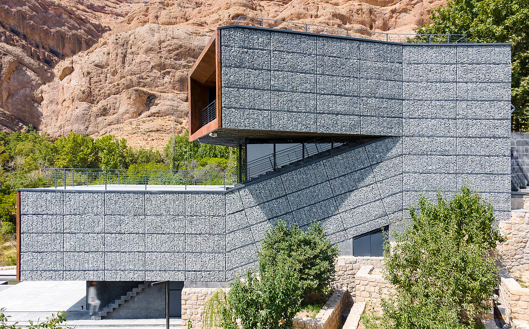 Striking modern architecture with angular concrete facade and cantilevered balcony.