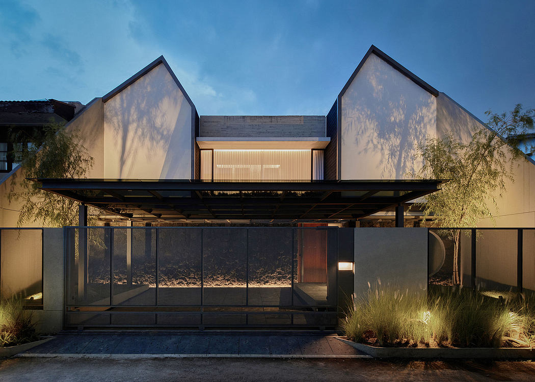A modern building with a raised platform, glass walls, and a wooden ceiling structure.