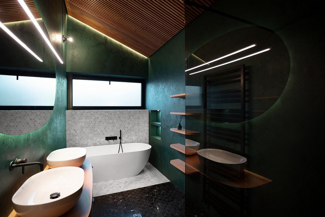 Striking modern bathroom with freestanding tub, shelving, and dark green walls.