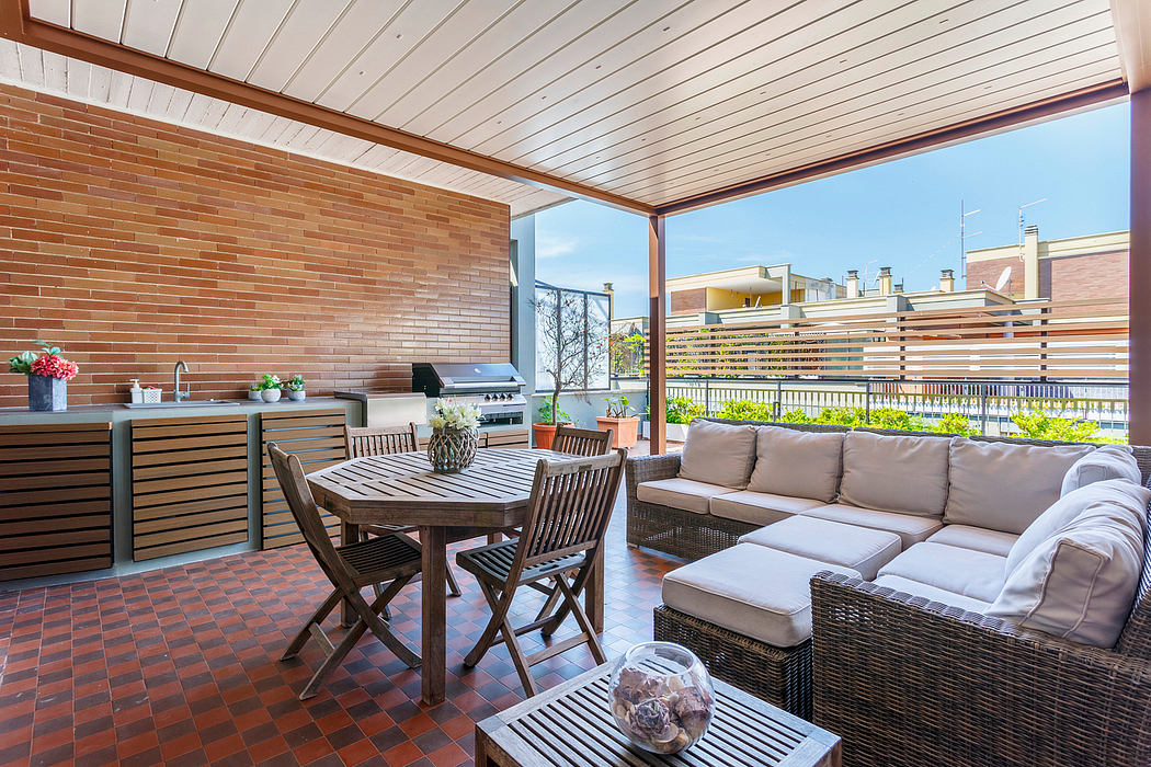 Cozy outdoor living space with brick walls, wooden furniture, and a covered patio.