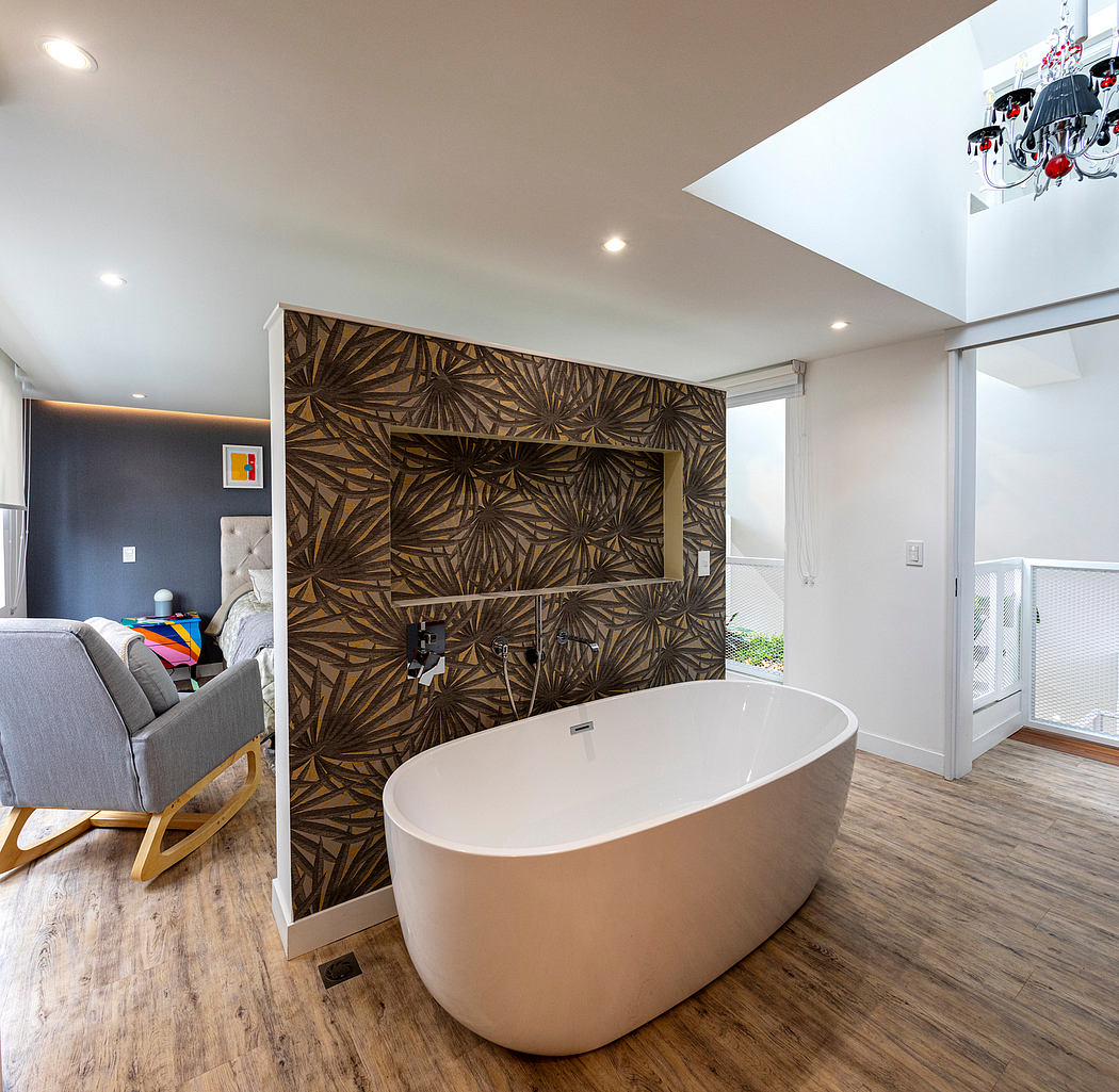 Modern bathroom with freestanding tub, wooden accent wall, and neutral color scheme.