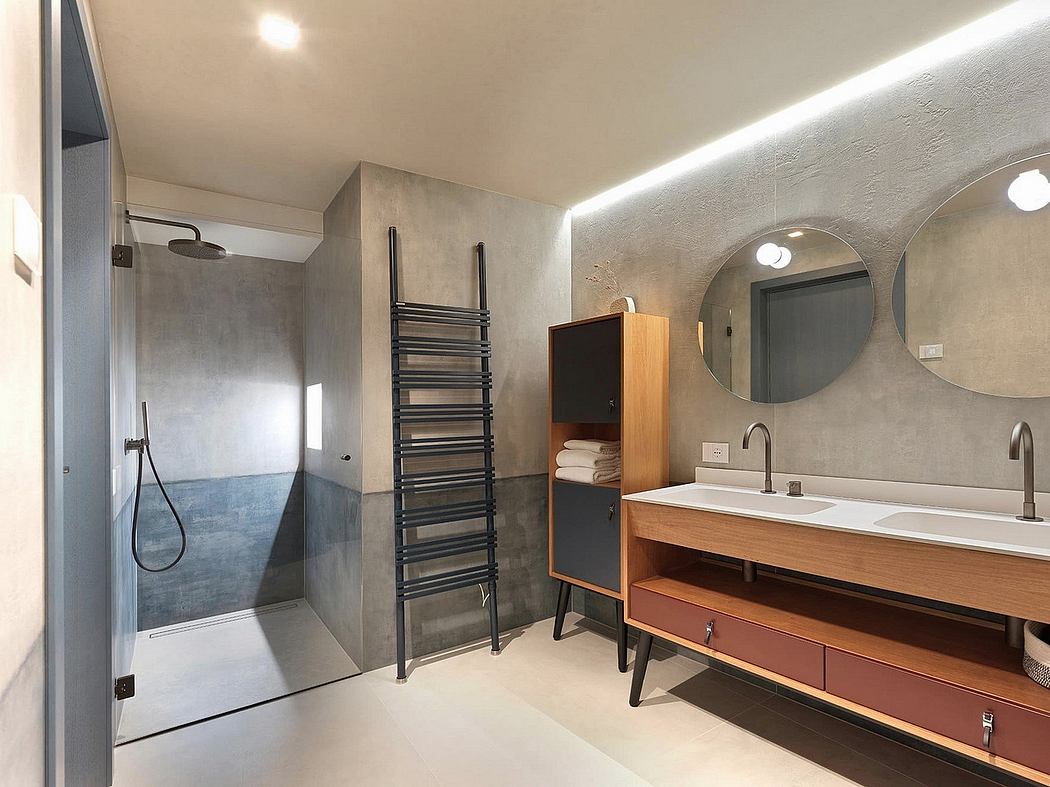 A modern bathroom with a walk-in shower, wooden vanity, and recessed lighting.