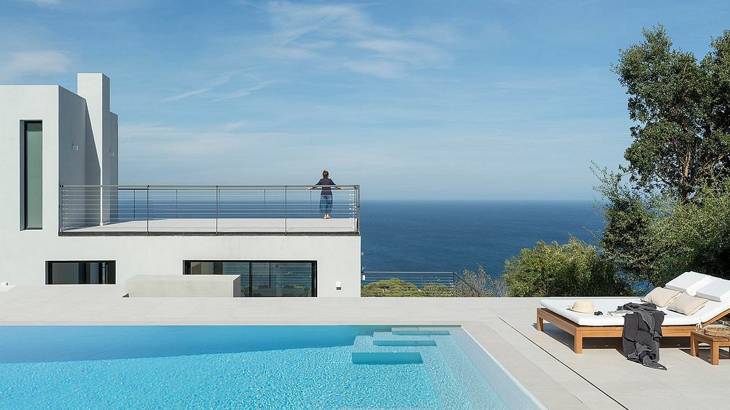 Modern cliffside villa with infinity pool and breathtaking ocean views.