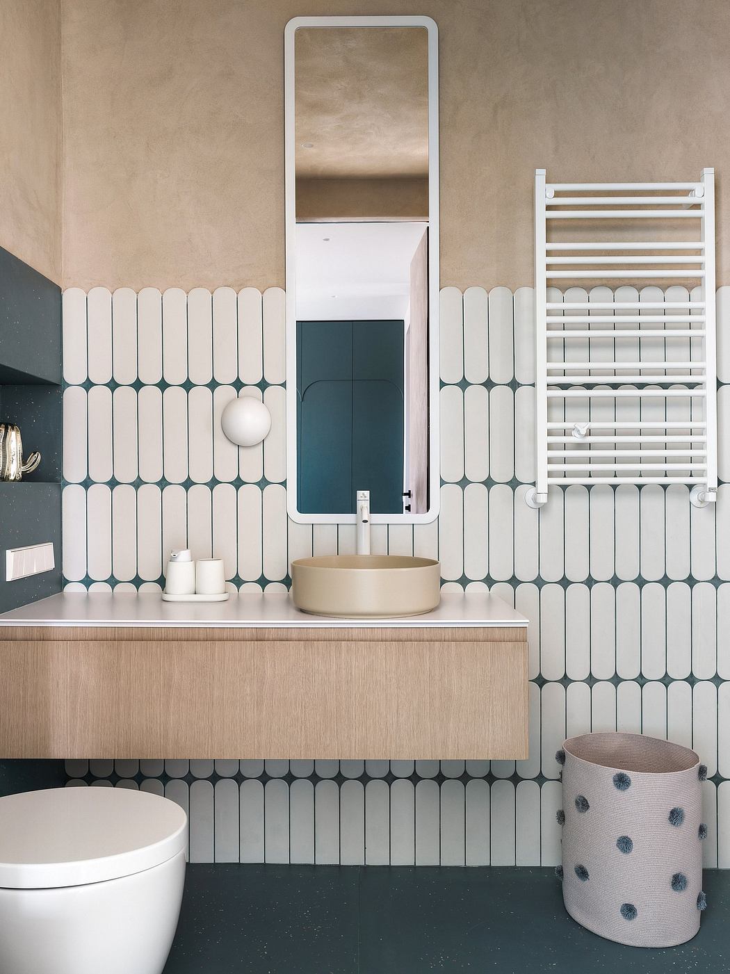 Contemporary bathroom featuring geometric tile patterns, minimalist vanity, and sleek mirror.