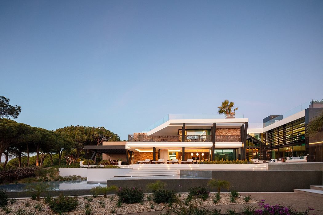 Striking modern architecture with clean lines, expansive glass walls, and thoughtful landscaping.