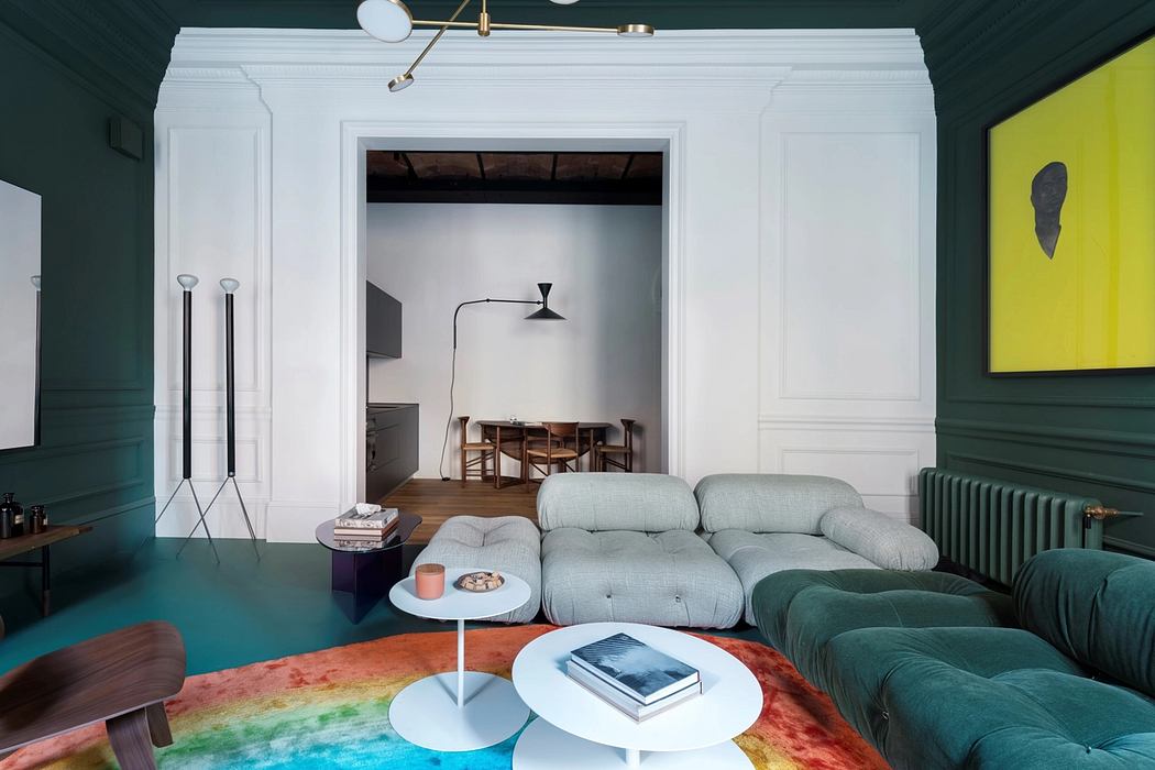 Eclectic modern interior with vibrant colors, comfortable seating, and architectural details.