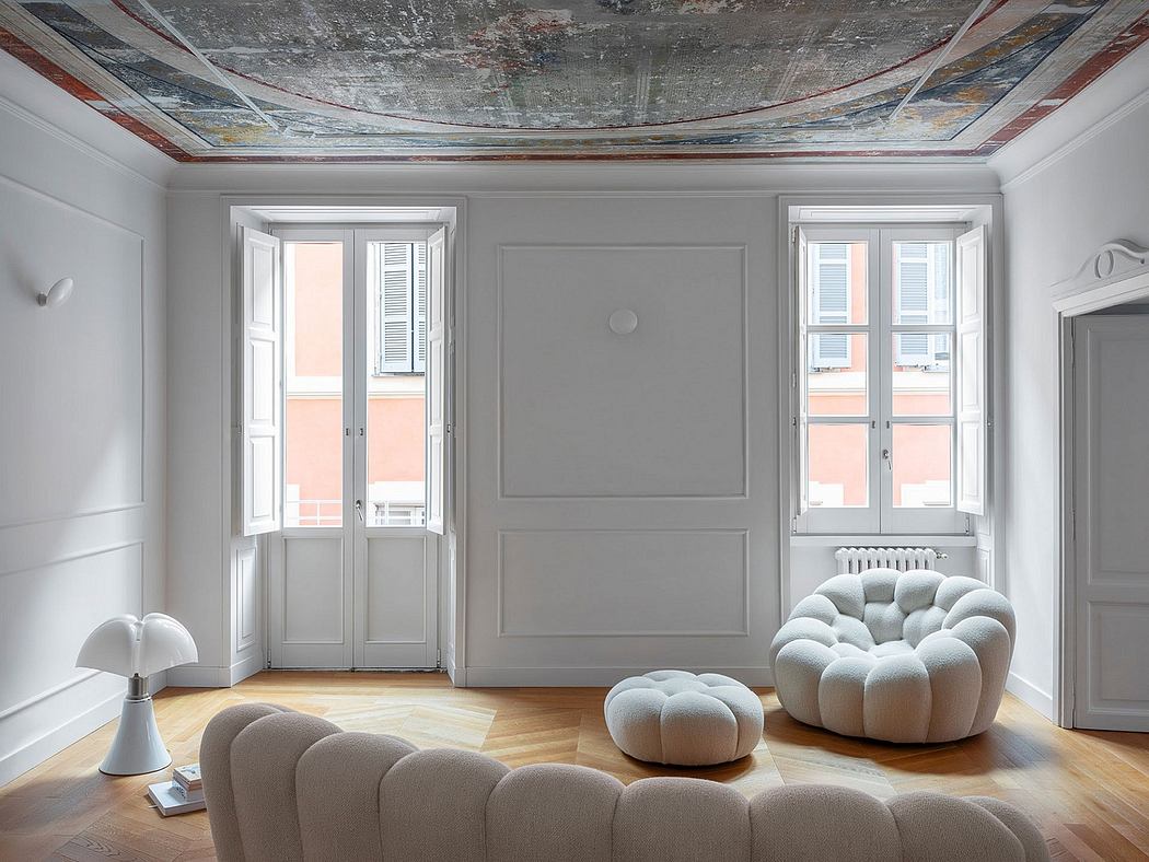 A grand, ornate room with intricate ceiling designs, large windows, and statement furniture.