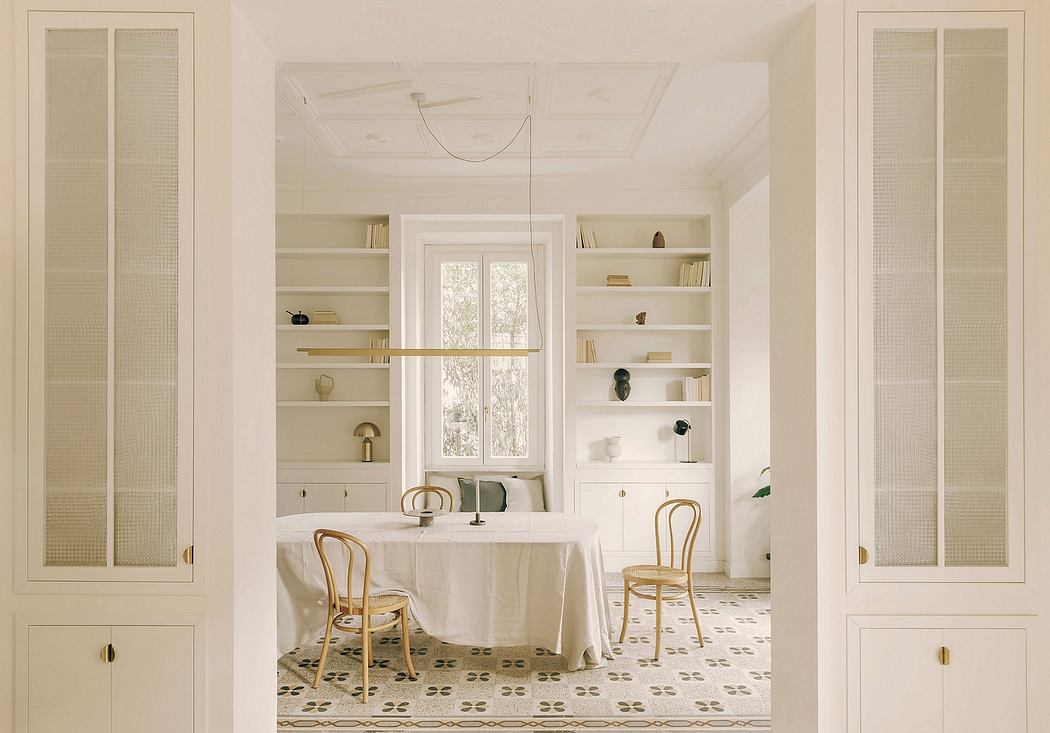 Spacious dining room with white walls, patterned tile floor, and built-in shelving.