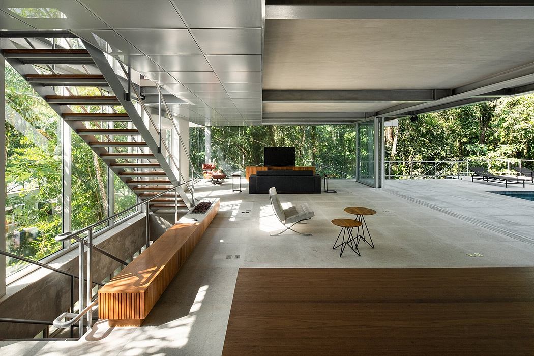 Expansive modern living space with glass walls, wood accents, and minimalist decor.