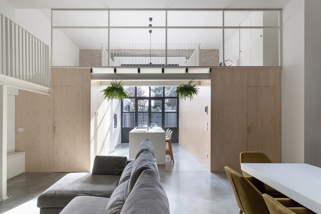 Sleek, minimalist interior with wood paneling, mesh screens, and lush potted plants.