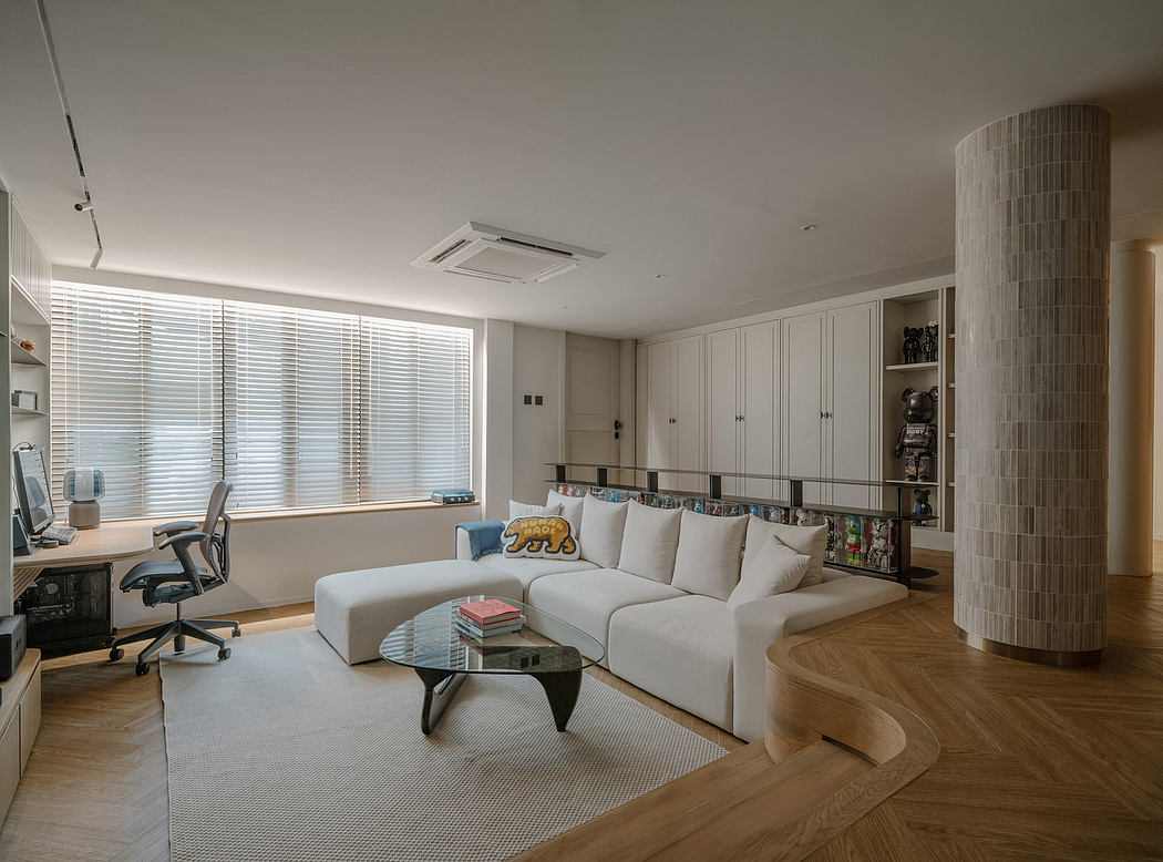 Bright, modern living room with built-in storage, large white sofa, and wood accents.