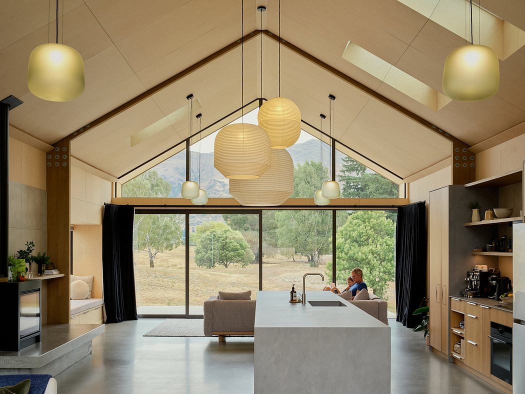 A spacious, modern room with high ceilings, large windows, and stylish pendant lights.