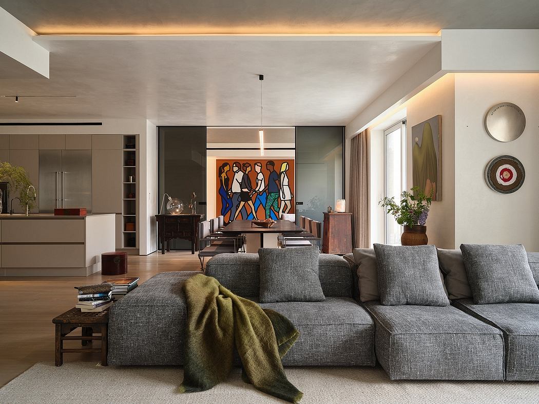 A stylish modern living room with a vibrant abstract art piece, sleek furniture, and warm lighting.