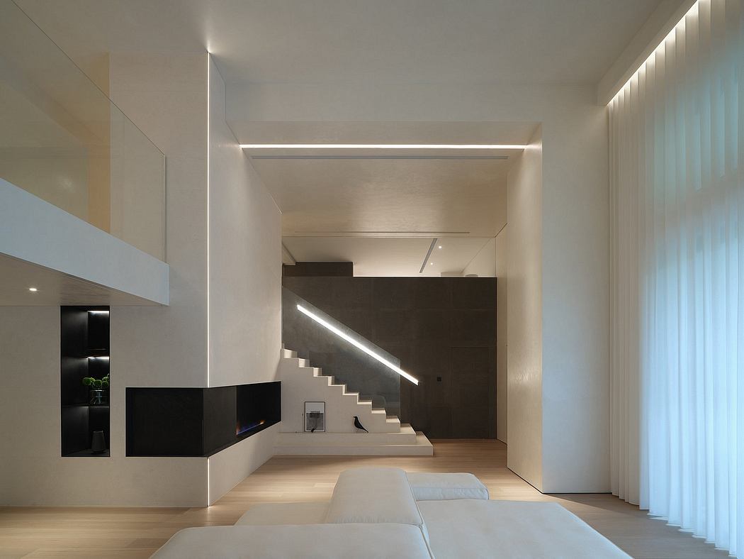 Minimalist living space with clean lines, stark lighting, and sculptural staircase.