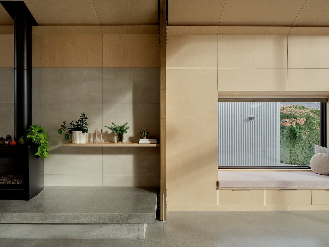 Sleek, minimalist interior with wood and concrete details, and a view through a window.