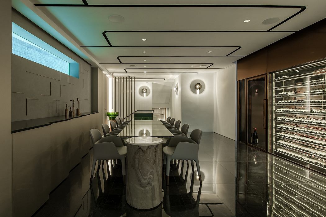 Sleek modern dining room with minimalist decor, pendant lights, and a marble table.