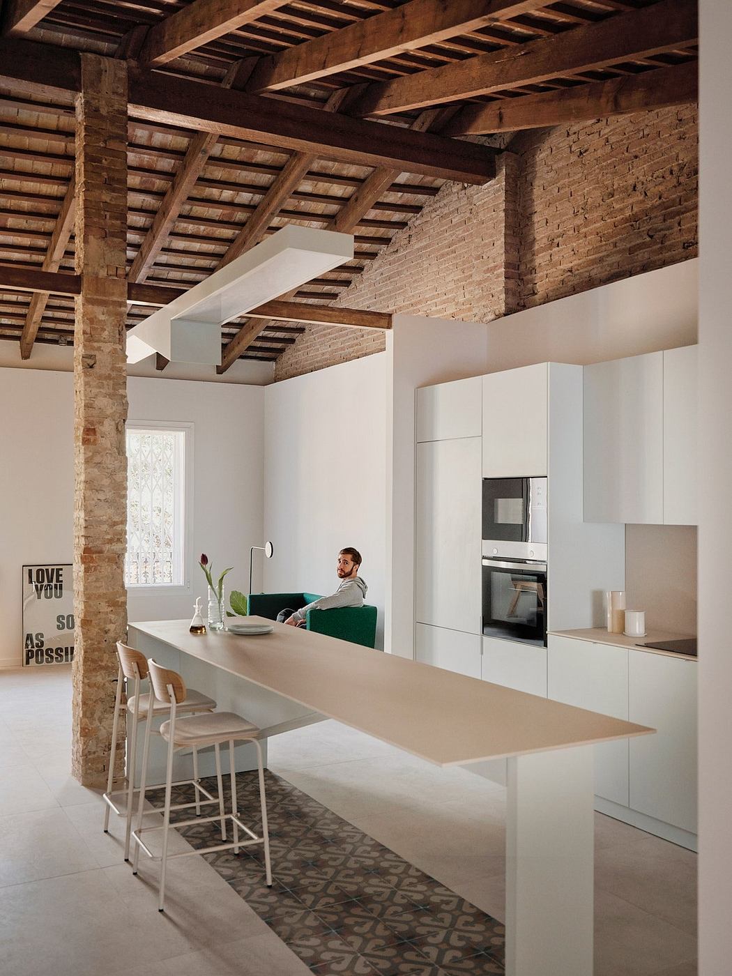 A modern kitchen with exposed brick walls, wooden beams, and a sleek, minimalist design.