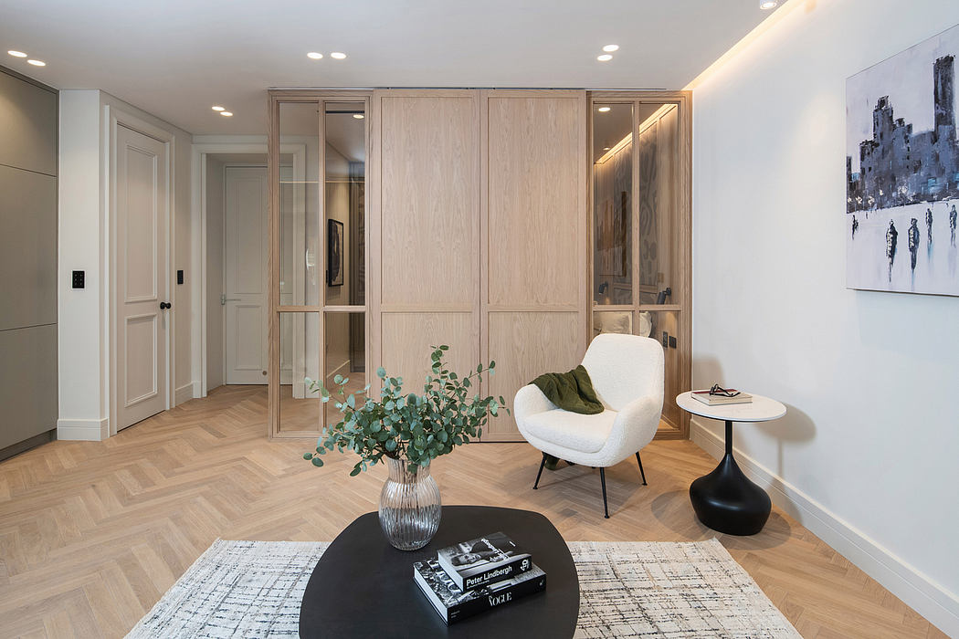 Spacious, modern interior with wooden cabinets, plush seating, and abstract artwork.