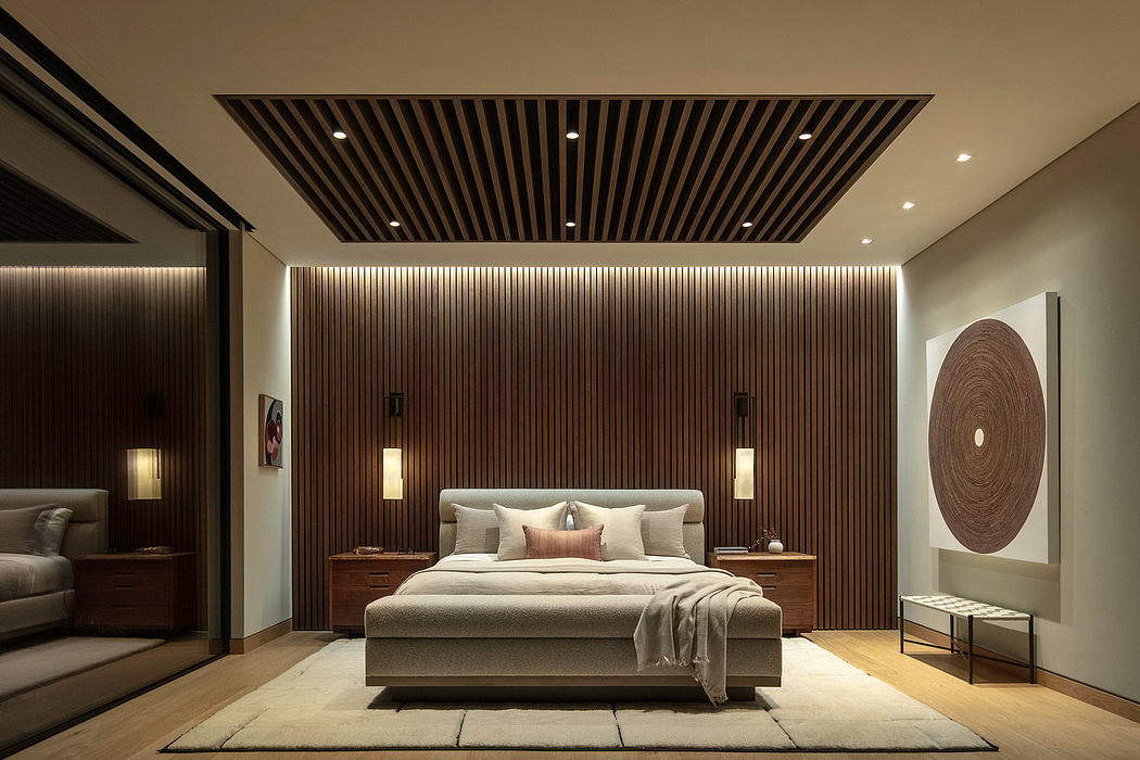 Elegant contemporary bedroom with striking wooden slat wall and modern furnishings.