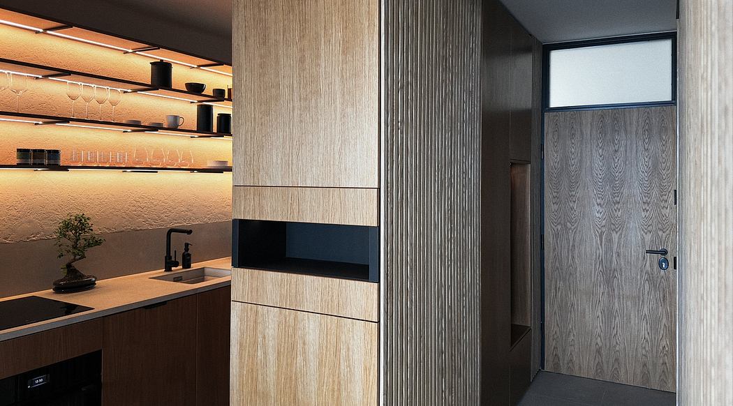 Minimalist kitchen with sleek wooden cabinets, recessed lighting, and built-in appliances.