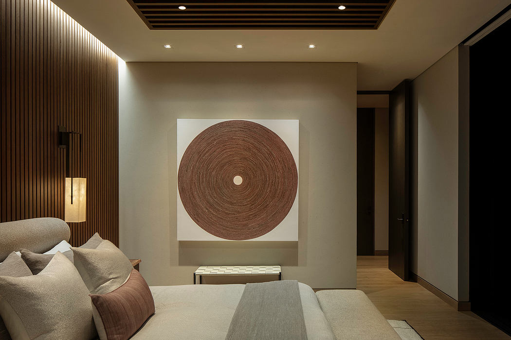 Serene minimalist bedroom with a circular textured artwork panel, wood-paneled walls, and recessed lighting.