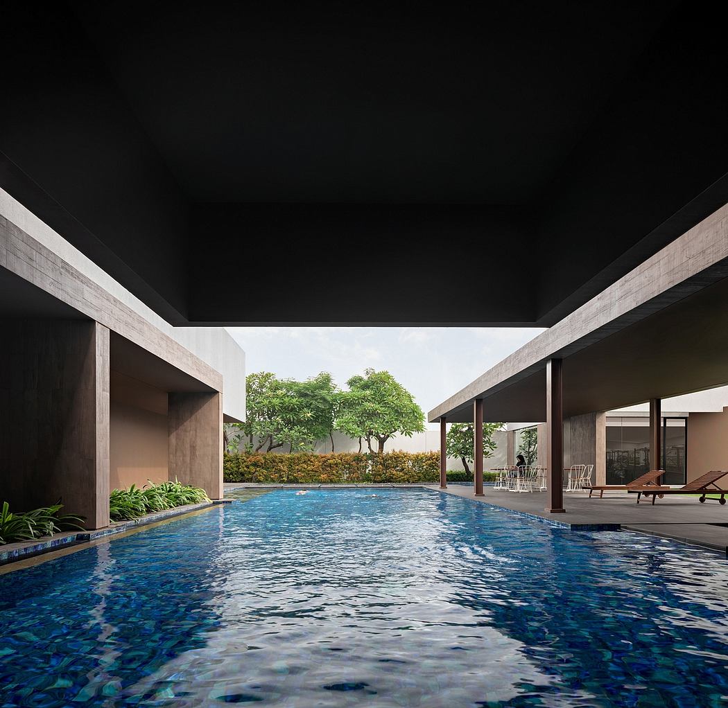 Sleek, minimalist architecture frames an inviting swimming pool and lush greenery.