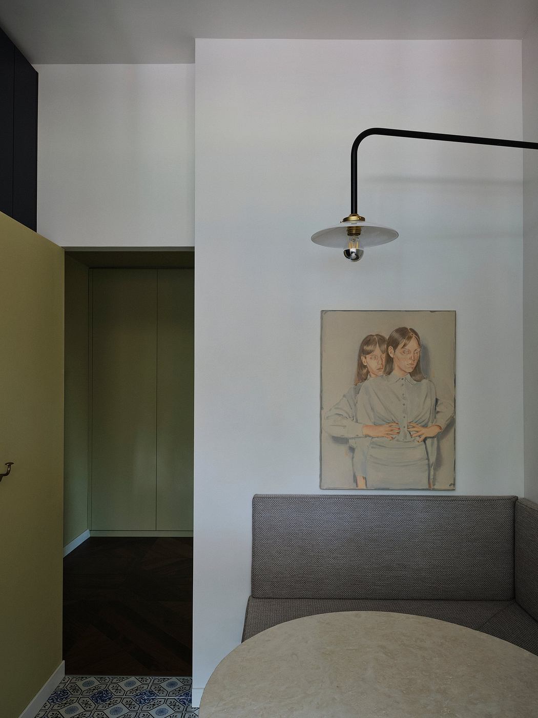 Clean lines, neutral tones, and a striking artwork highlight the minimalist yet stylish interior.