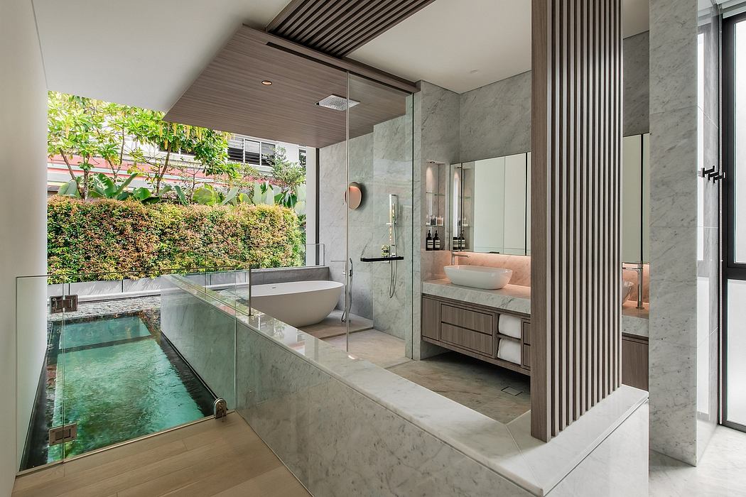 Expansive bathroom with glass wall, marble vanity, and sunken plunge pool.