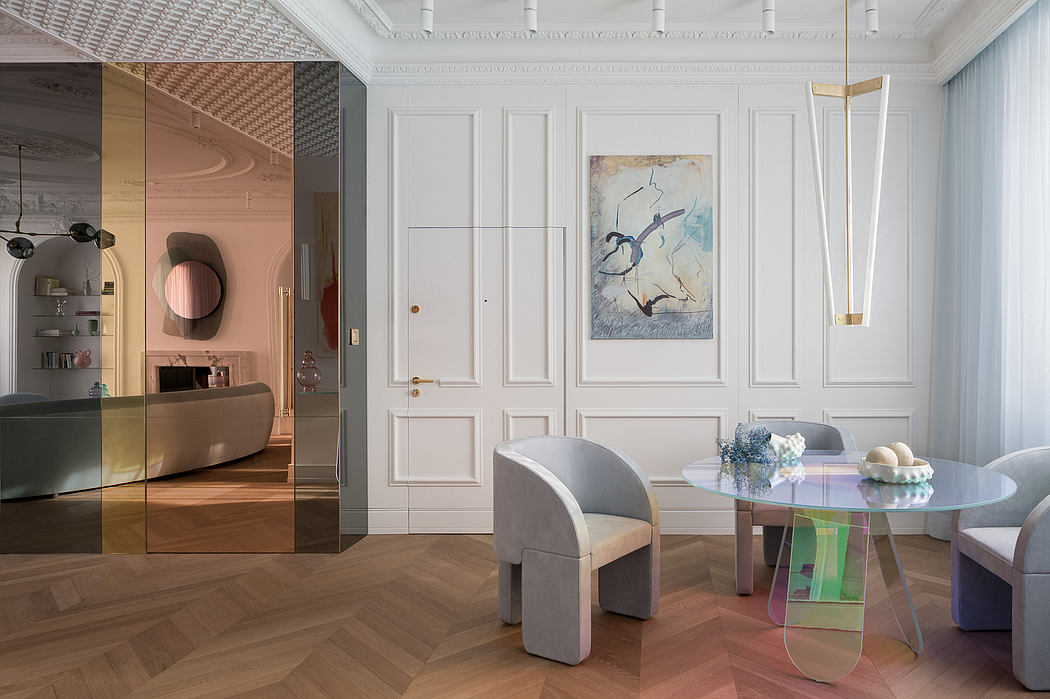 Elegant white wainscoting, modern furniture, and abstract artwork in this chic interior.