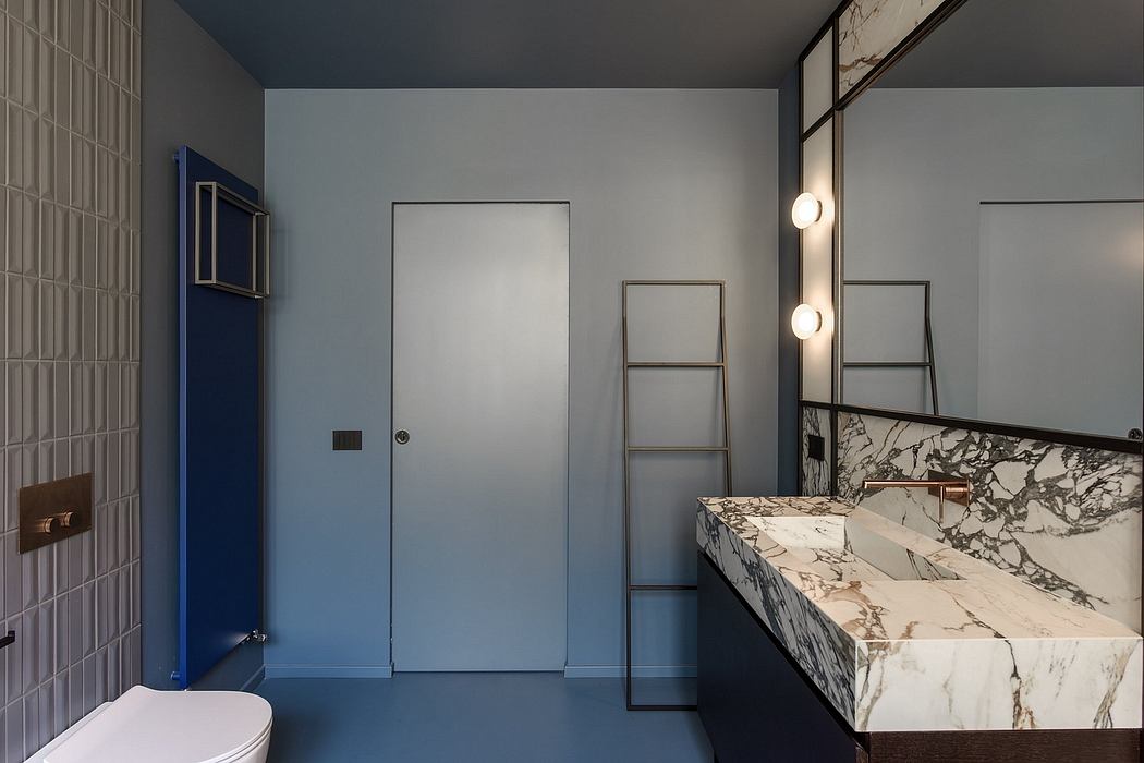 Sleek, modern bathroom design with marble vanity, minimal lighting, and contrasting colors.