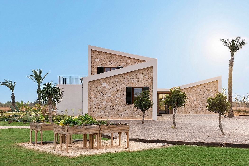 Modern architectural design with textured stone exterior, geometric shapes, and lush landscaping.