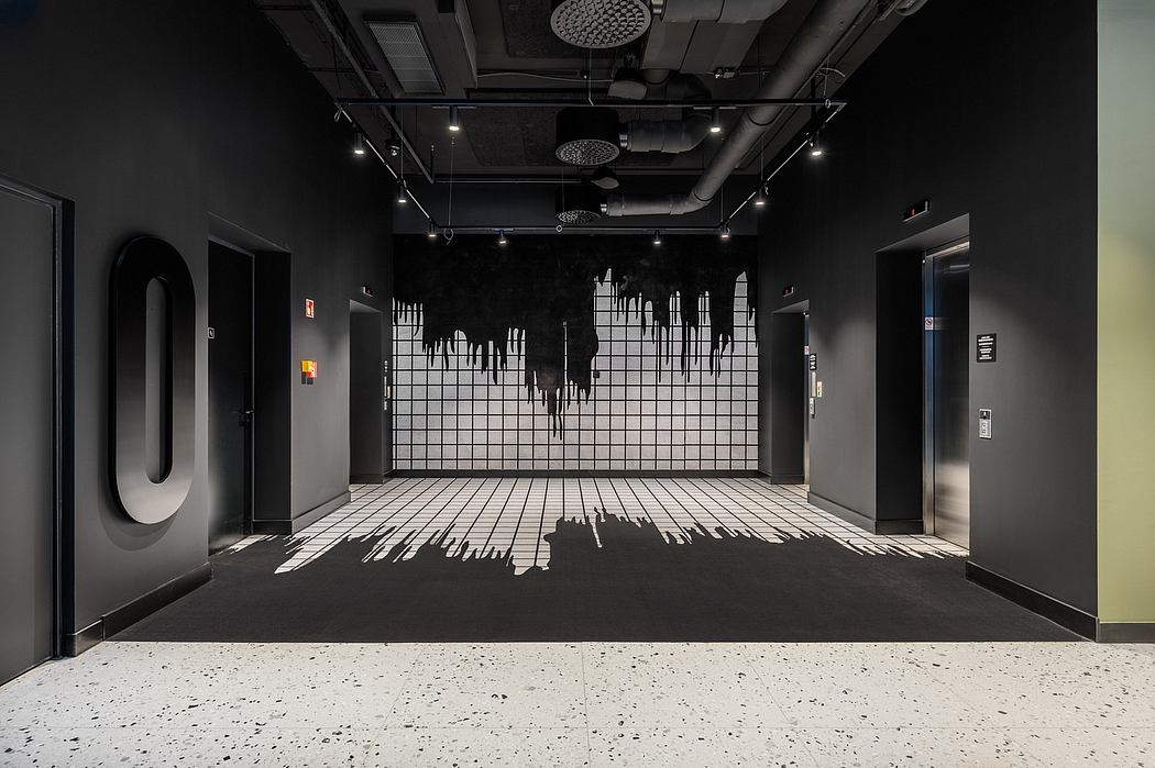 A dark, moody interior with graphic patterns on the walls, floors, and ceiling, creating an immersive environment.