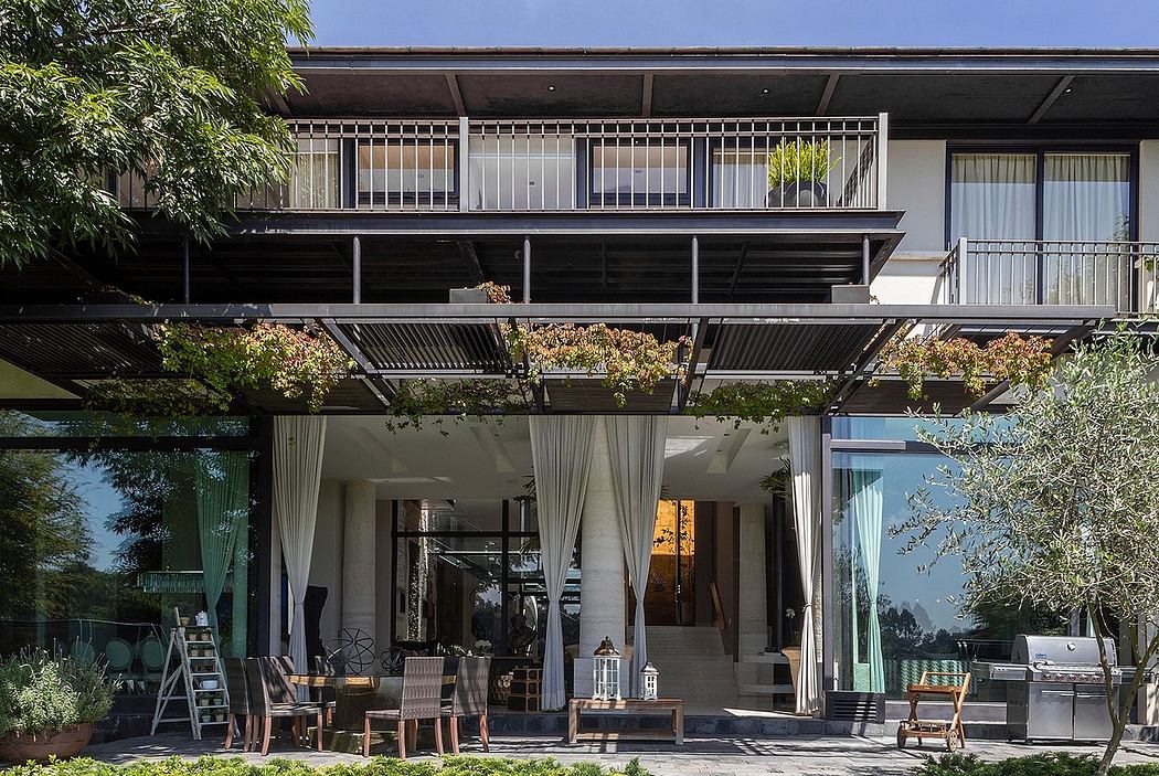 Sleek, modern architecture with well-designed outdoor living space and lush greenery.