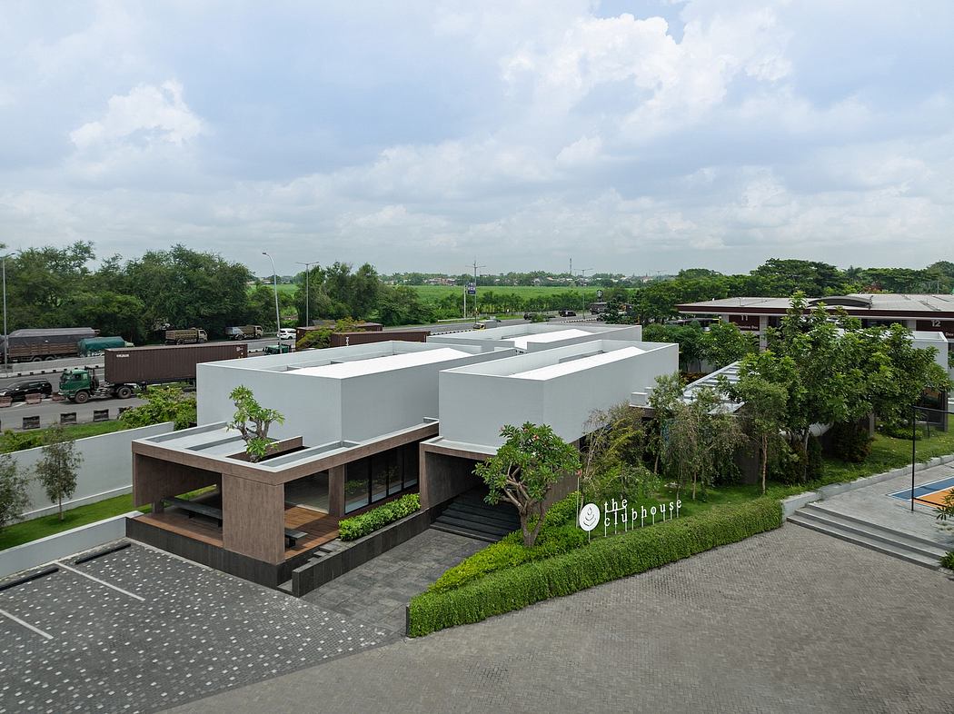 Modern modular architecture with extensive landscaping and greenery, evoking a harmonious balance.