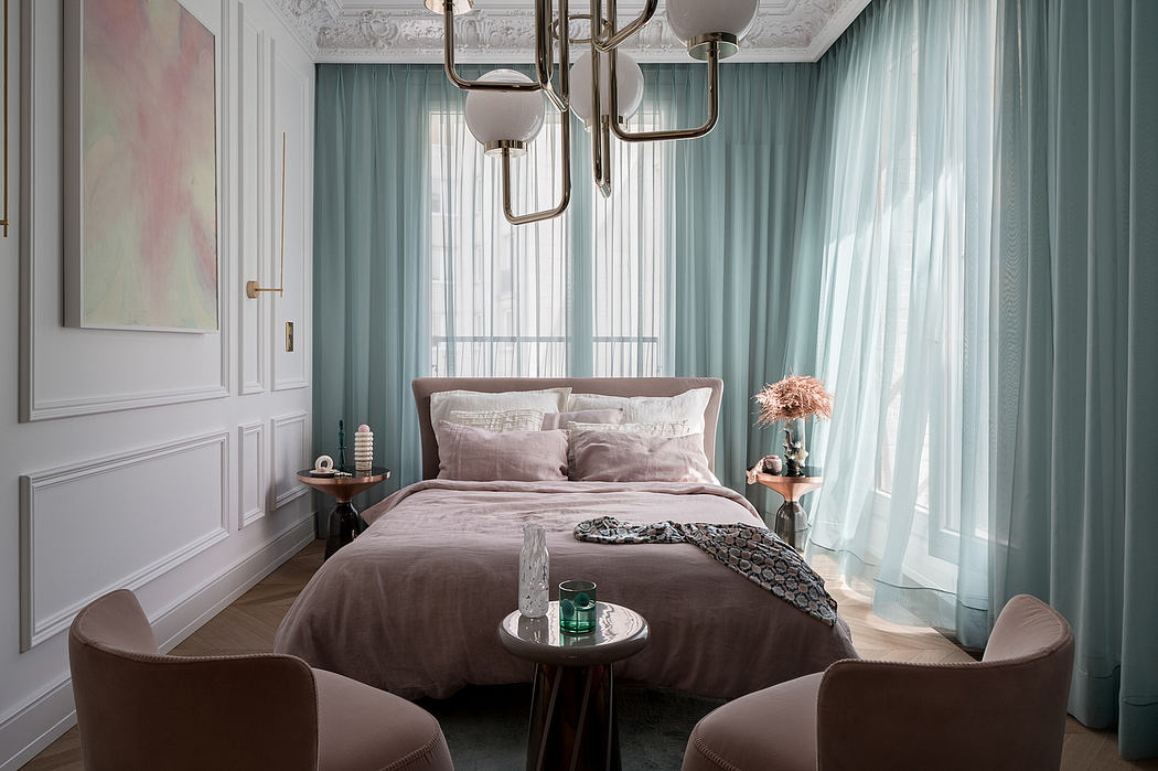 Elegant bedroom with ornate ceiling, plush curtains, and a cozy sitting area.