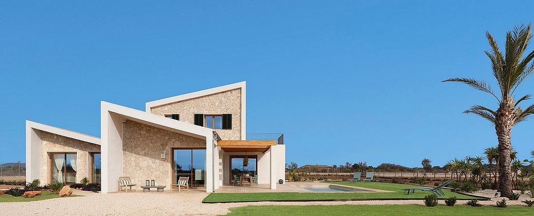 Elegant modern villa with clean lines, stone facade, and expansive outdoor spaces.