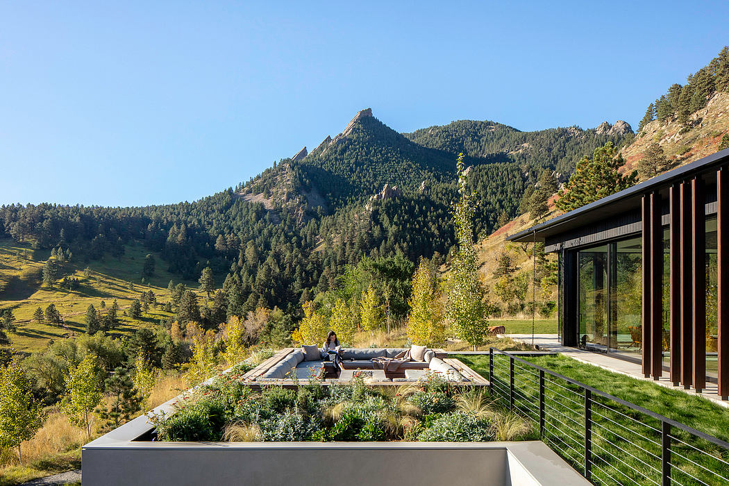 Stunning mountain vista seen from modern rustic home with spacious outdoor living area.