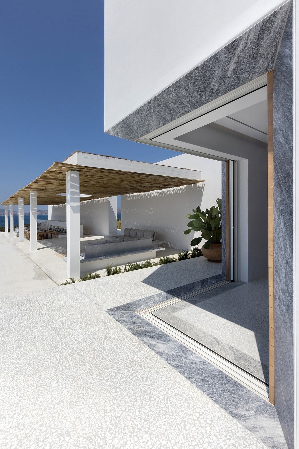 Sleek, modern architecture with clean lines, natural materials, and an inviting outdoor space.