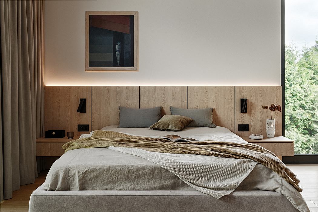 Cozy, minimalist bedroom with warm wood accents, built-in storage, and framed artwork.