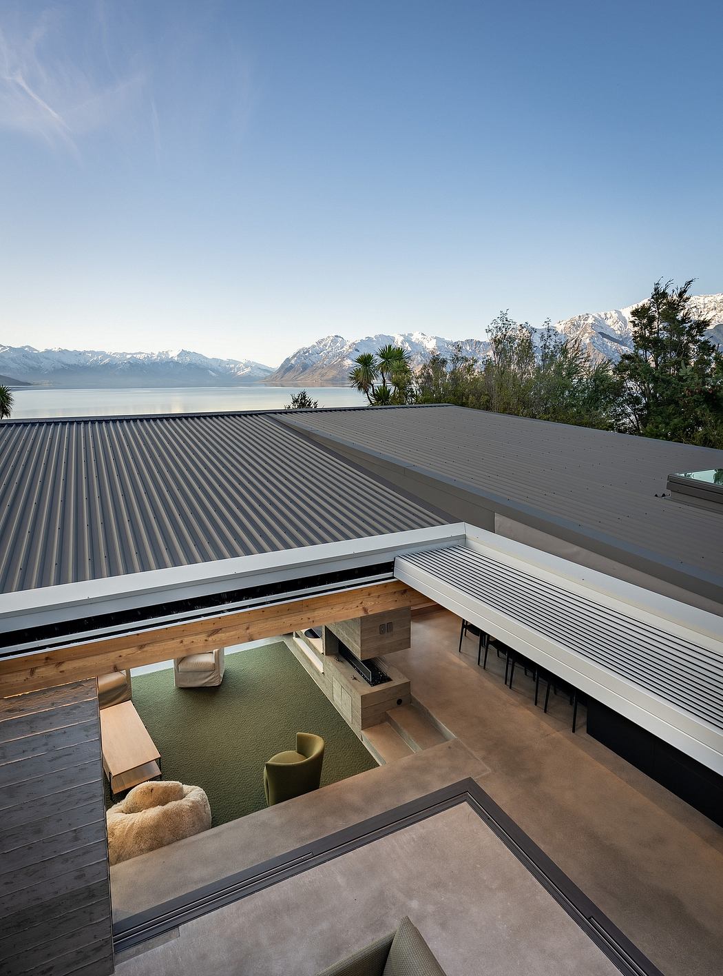 Panoramic views of snowy mountains from the modern minimalist concrete architecture.