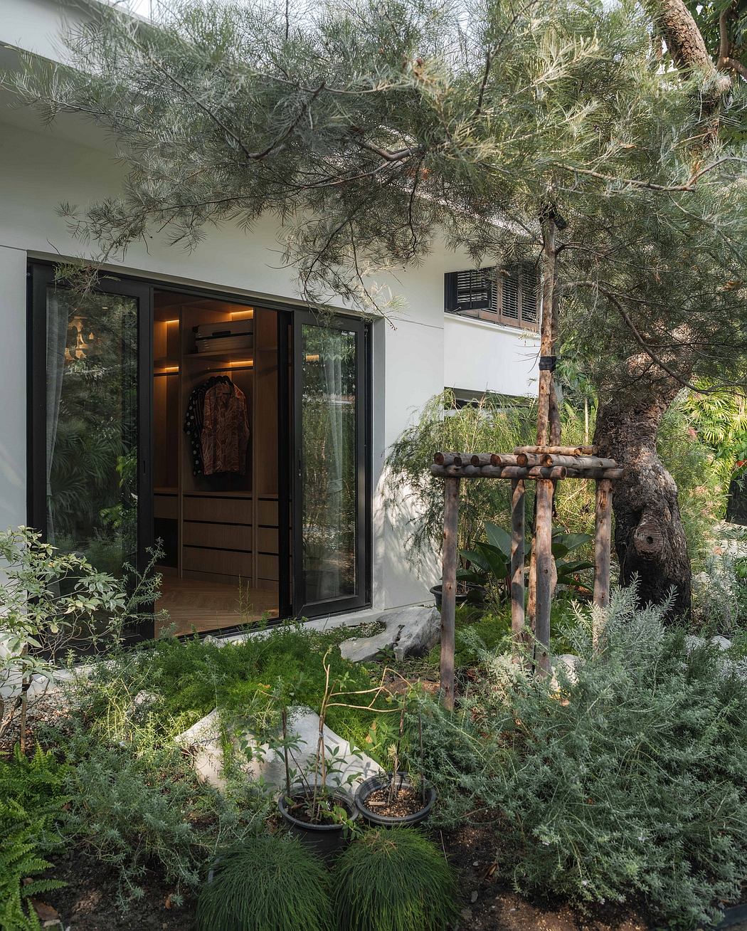 A cozy, natural-inspired dwelling with a rustic wooden structure and lush foliage.