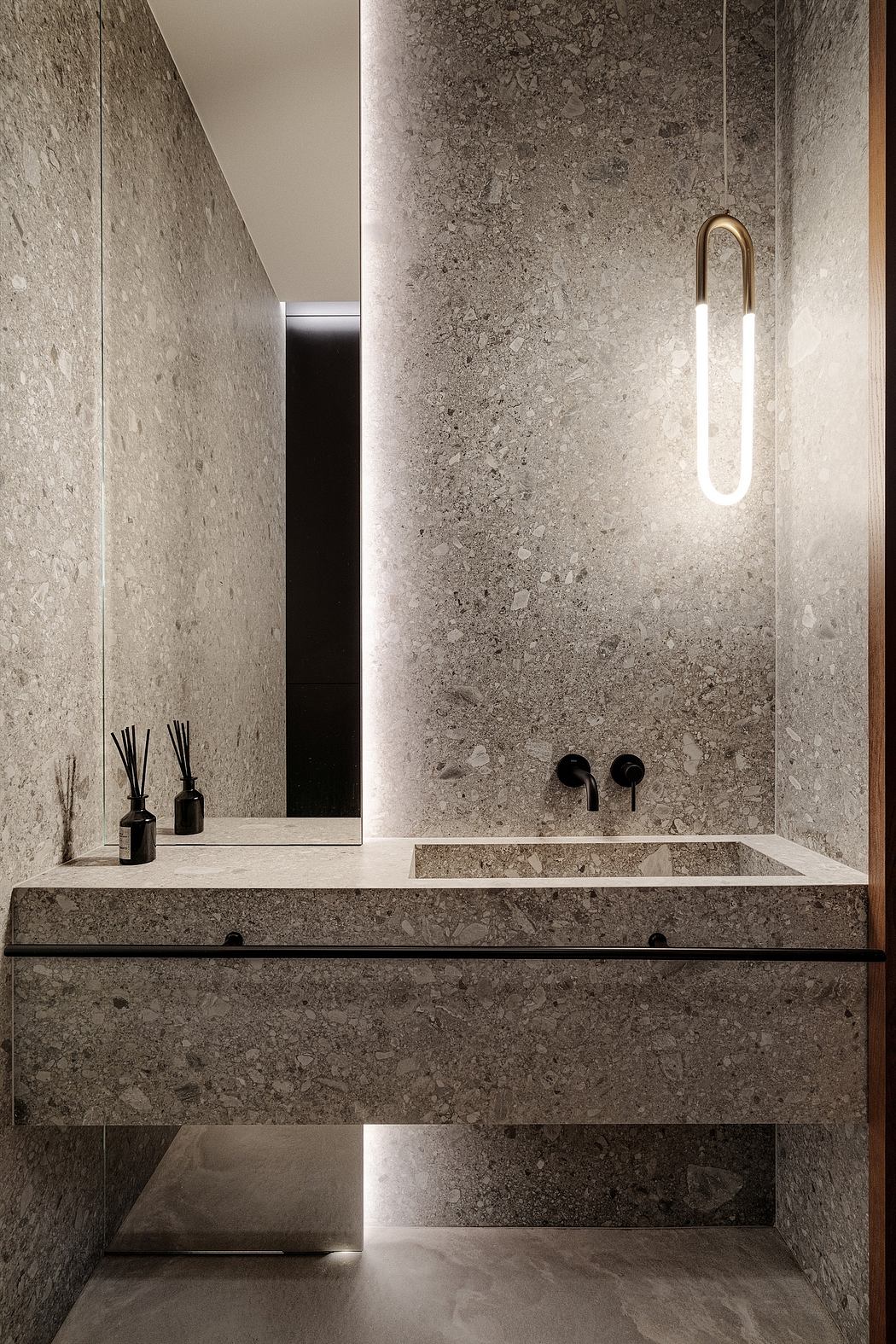 Minimalist bathroom with sleek grey marble walls, suspended vanity, and modern lighting.