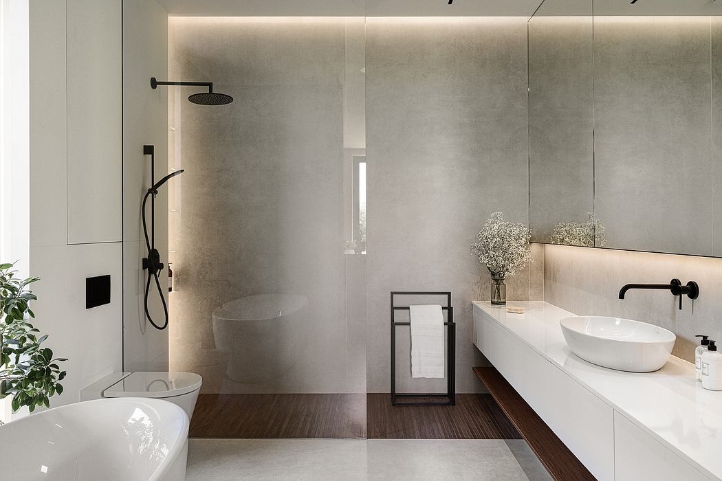 A modern bathroom with sleek, minimalist design featuring a glass shower, vessel sink, and warm lighting.