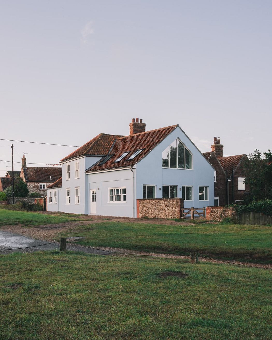 A countryside cottage with a mix of traditional and modern architectural elements.