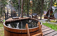 wooden bathroom in the forest in the mountains